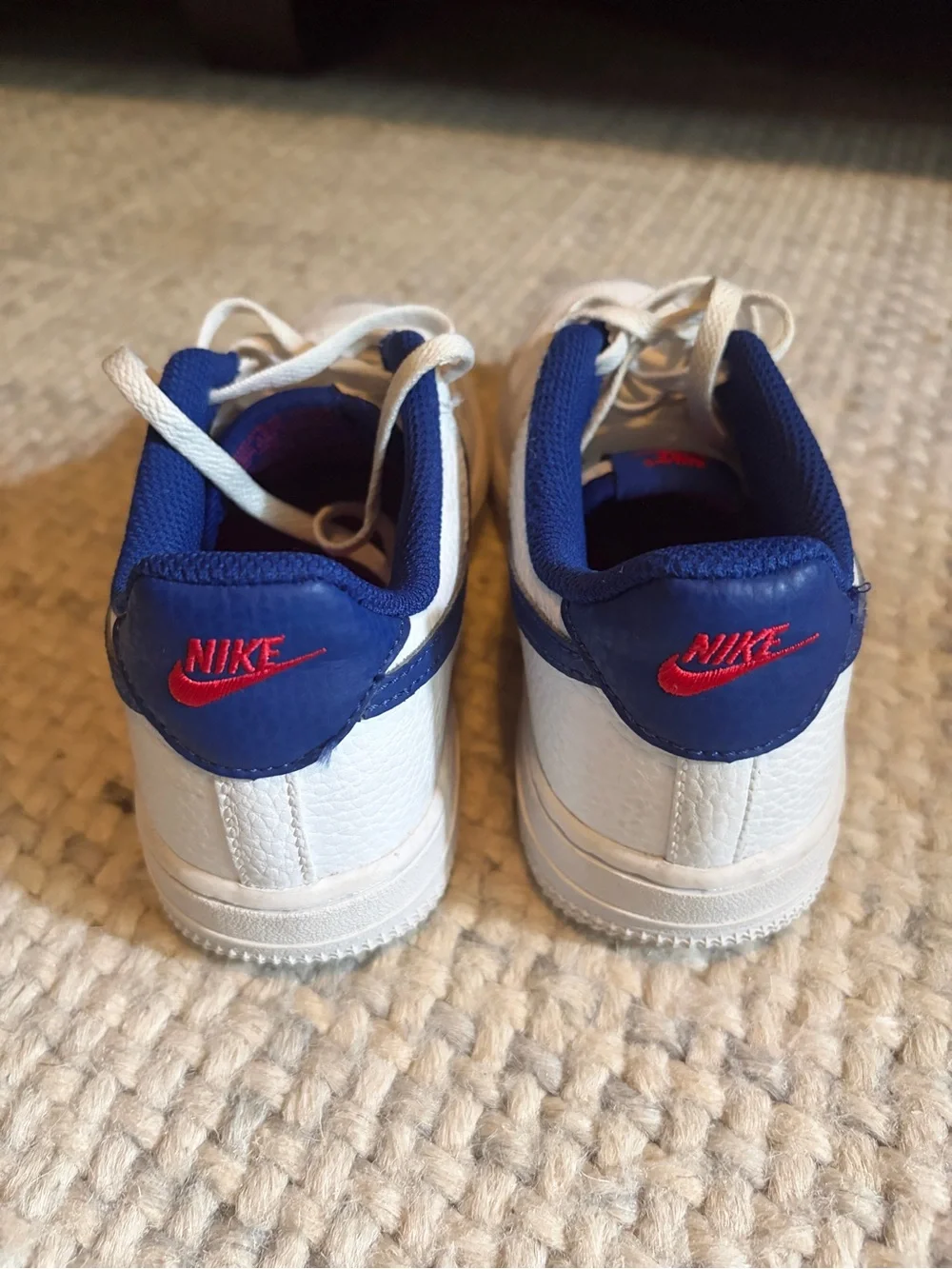 Nike Kids Air Force 1s White Sneakers with Blue Swoosh and Liner